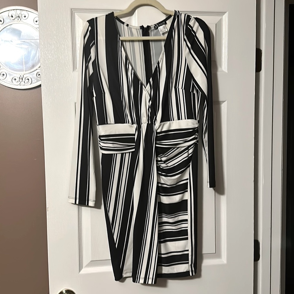 Venus black and cream colored dress with long sleeves.